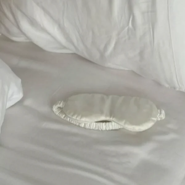 Sleep lesson: silk sleep mask on white linen